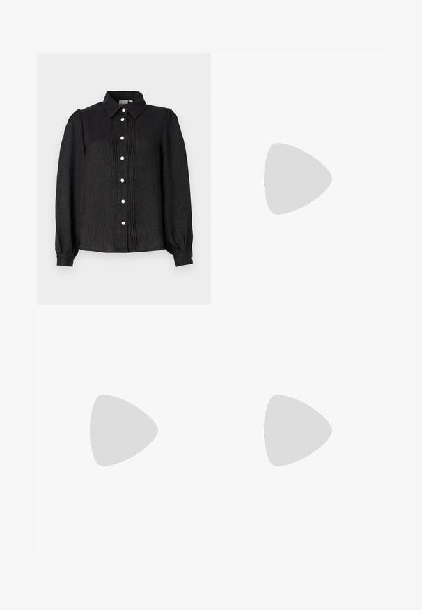 Black collared button-up shirt with textured fabric, featuring vertical pleats and pearl-like buttons along the front and cuff accents.; Black wide-leg pants featuring a textured fabric, an elastic waistband, and a detachable sash tie at the waist for adjustable fit.; Black open-toe heeled sandal with crossed straps, adjustable ankle strap, and a chunky heel, featuring a smooth leather texture.; Black handbag with structured shape, smooth texture, and a metallic clasp. Paired with wide black pants and open-toe sandals on wooden floor.