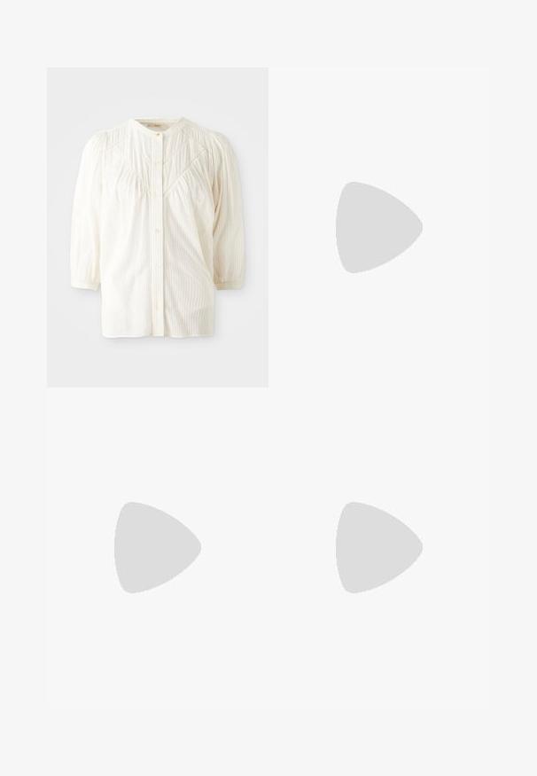 White ribbed button-up blouse with a round collar, pleated shoulders, and long sleeves. Features subtle vertical stripes and a relaxed fit.; Black skirt featuring a fitted waistband adorned with silver studs, pleated design, and a flowing silhouette extending to mid-calf.; Black patent leather slingback shoe with pointed toe, two strap detail, gold circular accents, and a low block heel.; Black quilted leather handbag with a gold chain strap and a toggle clasp featuring a circular accent. Compact rectangular shape.