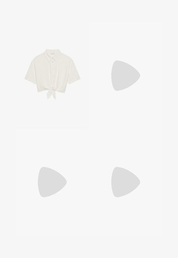 Ingekorte T-shirt met korte mouwen in lichtbeige linnen, met een knoopsluiting aan de voorkant en een strikdetail aan de onderrand. Soepele textuur met een klassieke kraag.; Wijdgevallen broeken in een lichtcrème kleur. Gemaakt van een zachte stof met plooien aan de voorkant en zijzakken.; Beige puntige slingback schoen met zwarte rand, gouden gesp en een chunky blokhak op een grijze vloer met een donker groene achtergrond.; Bruine suède schoudertas met twee lange hengsels, trekkoordsluiting en minimalistisch ontwerp. Gladde textuur en geen zichtbare hardware-accenten.