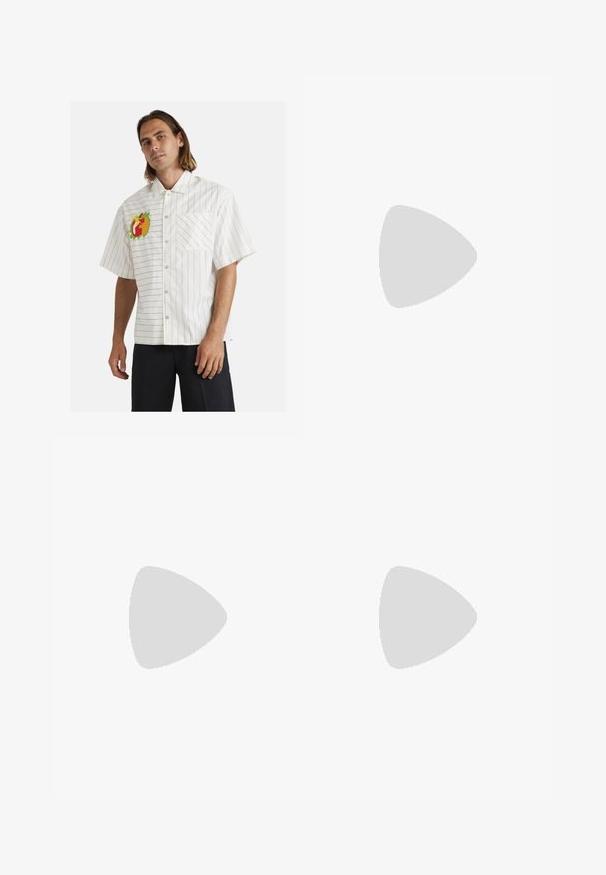 White short-sleeve shirt with black vertical stripes, featuring a colorful fruit embroidery on the left chest and a single front pocket.; Black cotton t-shirt with short sleeves, round neckline, featuring white "Champion" logo and text prints on the front and sleeve.; Corduroy wide-leg pants in a tan color. Features textured, vertical ridges, with a standard waistband and two front pockets.; White leather sneakers with gray accents, featuring perforated toe box, flat laces, and a patterned sole. New Balance logo on the side.