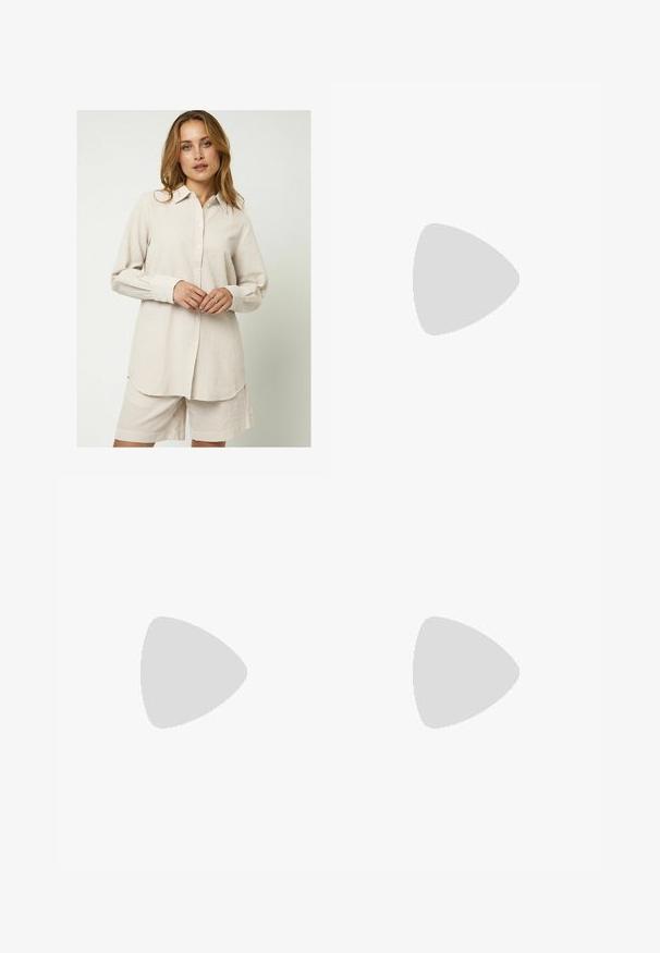 Moves ELASSU - Skjortebluser - warm sand; Sorte brede bukser lavet af glat, skinnende stof med elastisk talje og uden synlige lommer eller hardwaredetaljer.; Sorte og hvide ruskinds sneakers med flade hvide snører, teksturerede gummisåler og design med side-stribe. Båret med cremefarvede tapered bukser.; Sorte rektangulære solbriller med mørke linser og tykke matte stel. Armen er let tilspidset med en glat overflade.