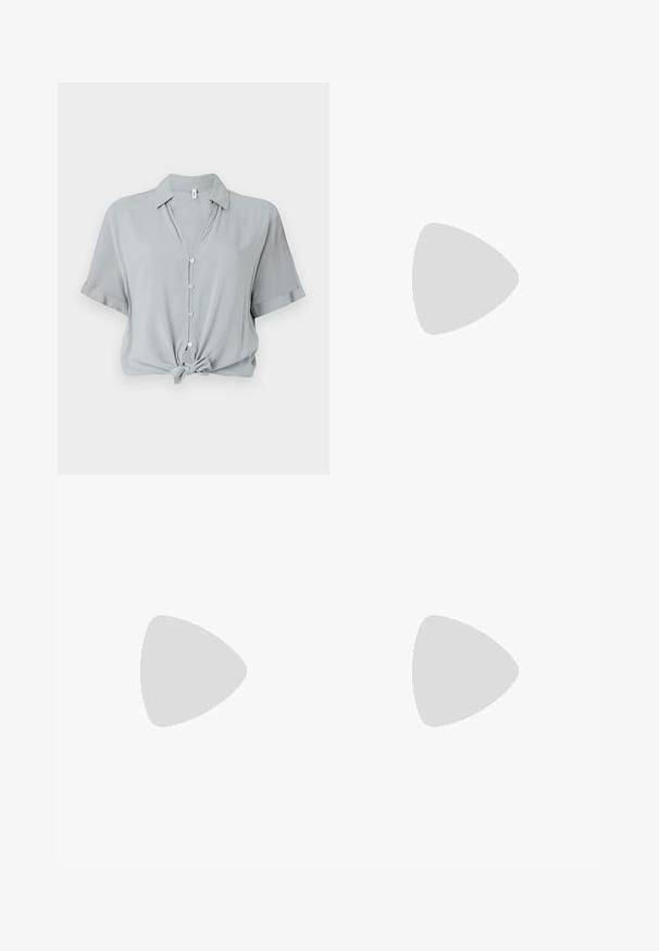 Light gray, short-sleeve shirt with a collar, front buttons, and a knotted hem. Made from a smooth, soft fabric.; Black flared jeans made of denim. Features a button closure, five pockets, and a smooth texture. The flared leg starts below the knee.; Black leather pointy-toe pump with an ankle strap and a chunky heel. Flat texture, sleek design, and minimalistic aesthetics.; Black leather handbag with a curved shape, detachable strap, and gold hardware. The bag features a flap with a buckle detail.