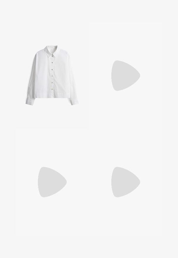Witte overhemd met lange mouwen, voorzien van een geborduurd ontwerp op de mouwen en een klassieke kraag. Gemaakt van lichte stof.; Donkerblauwe wijde jeans van denimstof met een hoge taille, voorzien van oranje stiksels, een vijf-pocket ontwerp en een knoopsluiting.; Sneakers met een crèmekleurige leren bovenkant, roze suède accenten en een gele hiel, voorzien van een rubberen zool en witte veters.; Zilveren metalen oorbellen met ronde vormen, een gepolijste afwerking en subtiele graveringen van het merk "BOSS" op de onderste secties.
