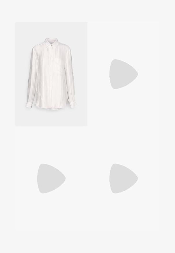 White long-sleeve shirt in a silky fabric with vertical ribbed texture, button-down collar, and a single chest pocket. Gold-tone button accent.; Beige tailored trousers with a straight fit, featuring pleats at the front, a smooth texture, and a mid-rise waist. No visible pockets.; Beige patent leather heeled sandals with cross strap design, open toe, adjustable ankle strap, and a block heel. Smooth texture.; Black leather handbag with a structured shape, short dual handles, gold-tone hardware, and a side tag accessory. Smooth, textured finish.