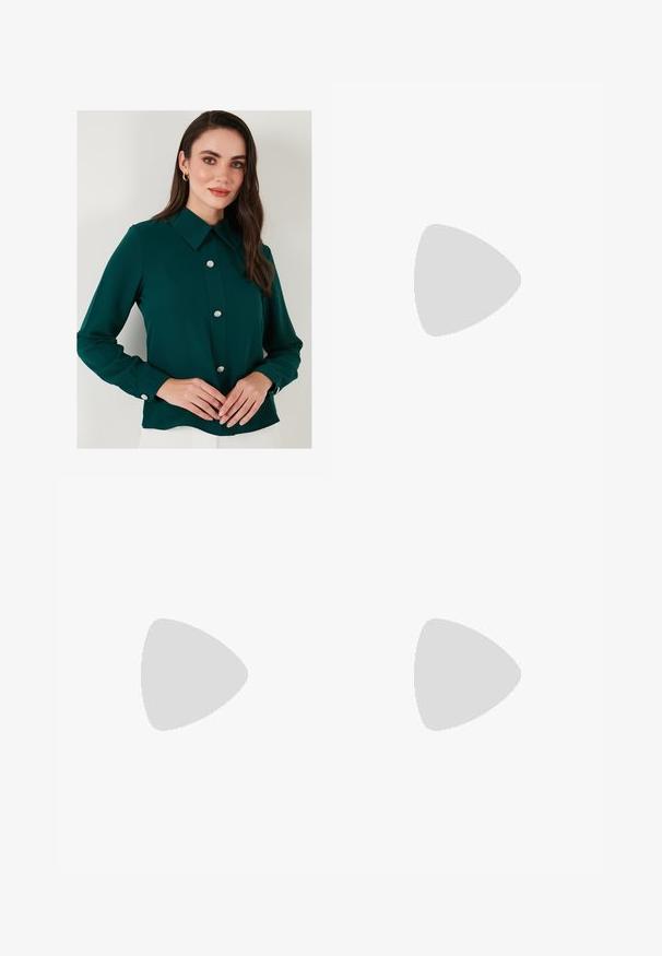 Dark green blouse with a collar, long sleeves, and decorative gemstone buttons down the front. Smooth fabric with a slightly glossy finish.; Brown wide-leg jeans made of denim, featuring a front button closure, five pockets, and visible stitching details.; Burgundy patent leather slingback shoes with a pointed toe, featuring two adjustable buckled straps and silver hardware accents.; Gold mesh strap watch with a black round dial, minimalist indices, and a silver crown; features a logo at 12 o'clock position.