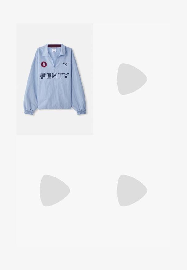 Light blue long-sleeve shirt featuring a folded collar, "FENTY" logo, and a round red patch with a logo, designed by Puma.; Dark blue straight-leg jeans with front pockets, belt loops, and a button closure.; Black patent leather slingback heels with a pointed toe and a geometric block heel. Features a sleek, minimal design and smooth texture.; Black leather handbag with a curved shape, detachable strap, and gold hardware. The bag features a flap with a buckle detail.