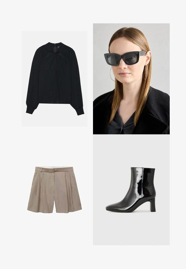Blouse noire en tissu léger avec un devant plissé, un col montant et des poignets élastiqués arborant une fermeture éclair dissimulée dans le dos.; Shorts plissés beiges en tissu à rayures verticales. Comprend une taille avec passants de ceinture et une coupe droite.; Bottines en cuir verni noir avec un bout pointu et un talon block de hauteur moyenne. Texture lisse et design minimaliste.; Des lunettes de soleil en forme de chat noir avec des verres foncés, des montures épaisses et des accents subtils. Portées avec un manteau noir et un haut gris, avec des cheveux longs et raides.