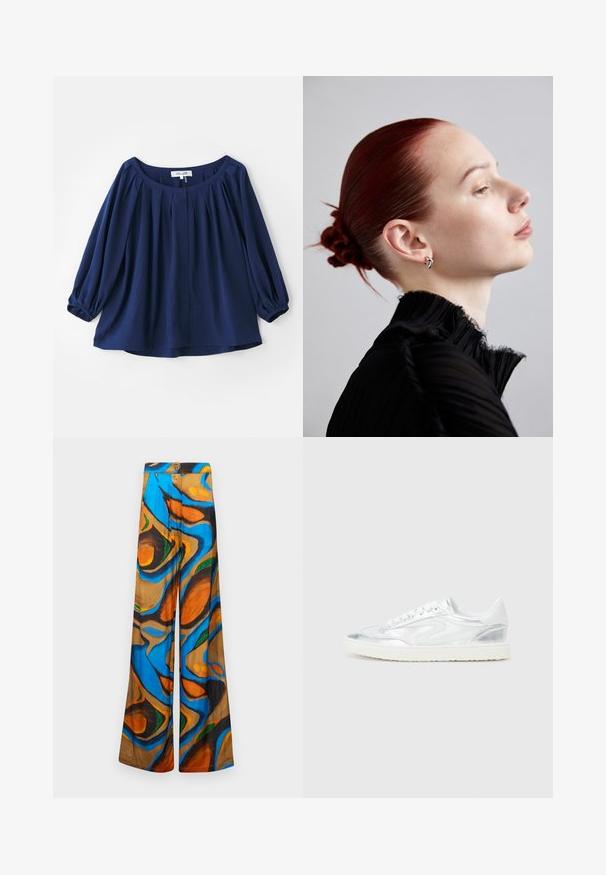 Siniharmaa pusero, joka on valmistettu pehmeästä kankaasta, jossa on leveä pääntie, napitus, laskokset edessä ja elastiset hihansuut täysipitkillä hihoilla.; Suorat lahkeet, joissa on monivärinen abstrakti kuvio sinisen, oranssin ja ruskean sävyissä. Valmistettu kevyestä kankaasta, jossa on sileä rakenne.; Valkoiset lenkkarit, joissa on metallinhohtoiset hopea-yksityiskohdat, sileä pinta, pyöristetty kärki, litteä pohja ja perinteinen nauhakiinnitys.; Hopeakoruissa, tekstuurilla varustetussa mustassa poimutetussa paidassa, jossa on korkea kaulus, ja sileä, tiukka punahiuksinen nuttura. Sivuprofiili vaaleaa taustaa vasten.