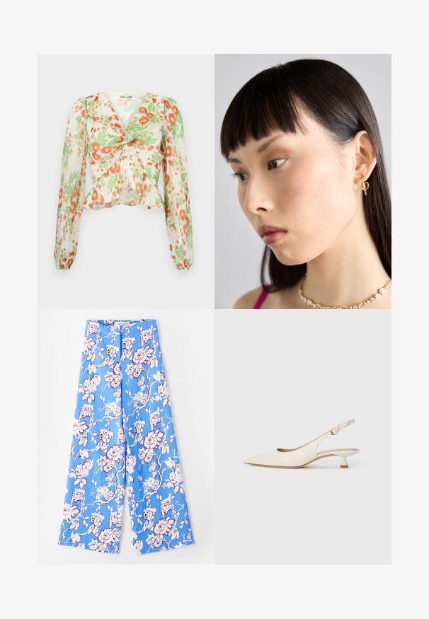 Diane von Furstenberg MARY - Užsagstoma palaidinė - marlene batik ivory; Mėlyni gėlių džinsai su pastelinių rožių raštu. Audinys yra lygus, su laisvu kirpimu, plačiomis kojomis ir elastiniu liemeniu.; Grietos spalvos smailianosiai slingback bateliai su žemu kitten kulnu ir auksine sagtimi ant vienodo balto fono.; Auksinė įvorės auskaras, dėvimas dešinėje ausyje, su atviru dizainu. Modelis turi tiesius tamsius plaukus ir minimalų makiažą.