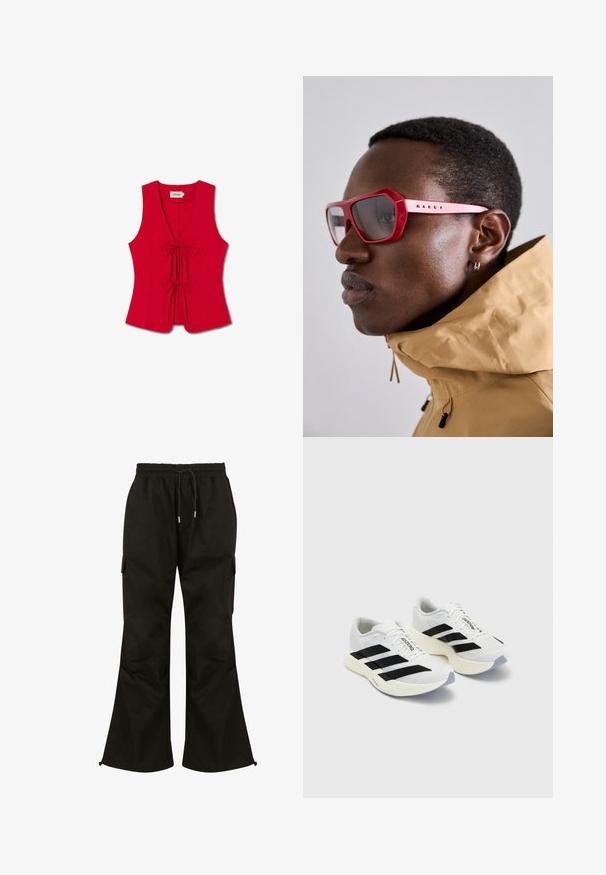 Rotes ärmelloses Oberteil mit tiefem V-Ausschnitt und zwei vorderen Bindebändern, gefertigt aus glattem Stoff mit taillierter Passform und dezentem Muster.; Schwarze Cargo-Hosen mit weitem Bein, elastischem Bund, verstellbarem Kordelzug und Seitentaschen. Aus glattem, strapazierfähigem Stoff gefertigt.; Weiße Sportschuhe mit schwarzen Streifen und Branding, ausgestattet mit einem oberen Mesh, abgerundeter Zehenpartie und dicke cremefarbene Sohle für Dämpfung.; Rote, eckige Sonnenbrille mit einem dicken Rahmen und getönten Gläsern. Präsentiert an einem Model, das eine beigefarbene Steppjacke mit hohem Kragen trägt.
