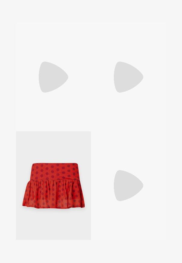 Long-sleeve top featuring a black base with a red lace bra graphic, round neckline, and a stretchy, smooth texture.; Red ruffled skirt with black polka dots, made of lightweight fabric. Features a fitted waistband and layered design.; Black slingback high heels made of smooth fabric with a pointed toe and fabric bow detail on the front. Slim stiletto heel.; Black square sunglasses with a matte finish, featuring transparent lenses and a slight blue tint on one side. Robust, angular design.