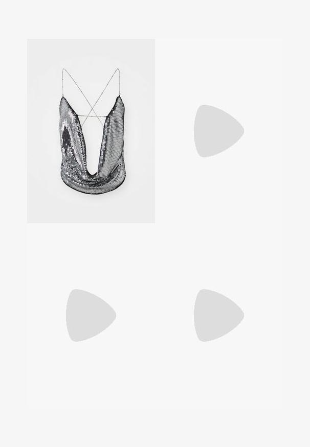 Silver sequin top with deep V-neck and crisscross chain straps; features a shiny, reflective surface and draped fabric design.; Grey trousers with a straight leg design, featuring two side pockets and a button closure. Smooth fabric with no visible patterns or accents.; Black leather over-the-knee boot with a square toe, block heel, and a side buckle strap. Smooth texture with a fitted silhouette.; Black leather shoulder bag with a rounded shape, glossy finish, and silver hardware. Person wearing black wide-leg pants and studded loafers.