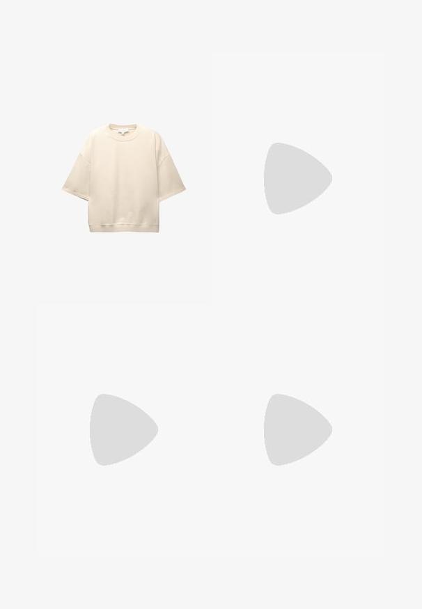 Krem majica s oversized krojem, izrađena od mekog pamuka. Ima okrugli izrez, kratke spuštene rukave i ležeran kroj. Minimalistički dizajn.; Svijetlosive široke hlače od mješavine pamuka, s visokim strukom, strukturiranim pojasom i vidljivim šavovima.; Bijele kožne tenisice s svijetloplavim detaljima, sivim nubuk vrhom i smešnim gumiranim đonom. Imaju tri plava pruga i "Samba" oznaku.; Crne velike sunčane naočale s ovalnim staklima, glatkim plastičnim okvirom i zlatnim detaljima na sljepočnicama. Tamna stakla pružaju zaštitu od sunca.
