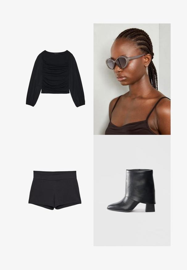 Top noir à manches longues présentant un détail de tissu froncé à l'avant et aux poignets, fabriqué en matière douce et extensible avec un col bateau.; Shorts noirs ajustés avec une large ceinture, fabriqués dans un tissu doux et extensible. Les ourlets sont lisses sans fermetures ni motifs visibles.; Bottine en cuir noir à bout pointu, texture lisse et talon bloc structuré. Elle se distingue par un design de revers haut et plié.; Lunettes de soleil grises surdimensionnées avec une forme arrondie et des verres foncés. Monture en plastique élégante avec une finition lisse. Le modèle a des cheveux tressés.