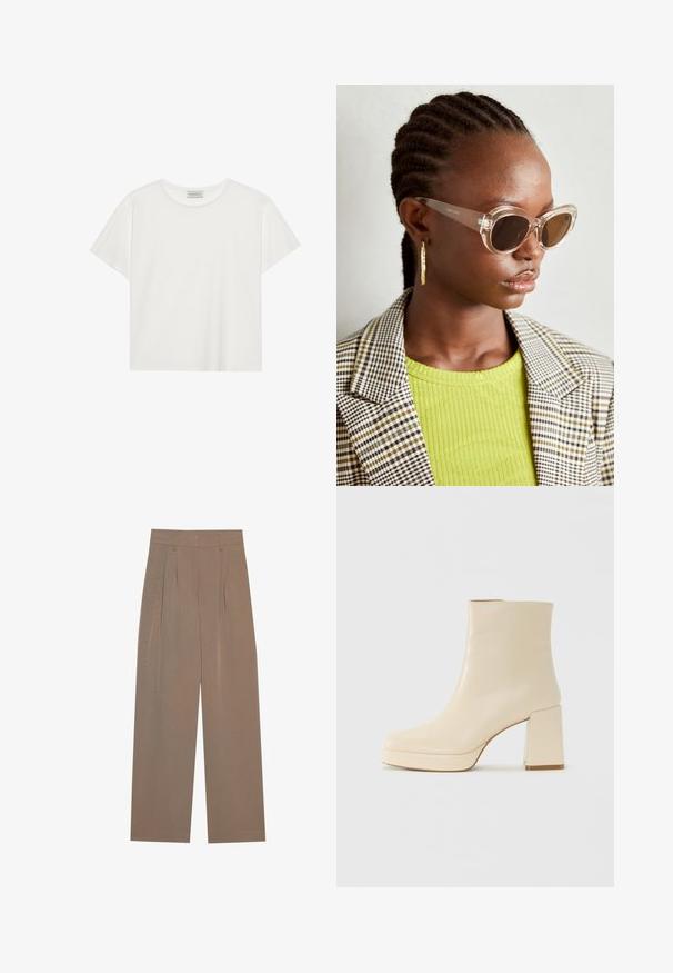 Tricou alb cu mânecă scurtă, made din bumbac moale. Are un guler rotund și o croială lejeră. Design curat, fără modele sau accente vizibile.; Pantaloni plisati maro cu un design cu picioare largi, având un brâu plat și buzunare laterale, confecționați dintr-un material ușor.; Cizmă de gleznă din piele bej, cu toc pătrat și talpă platformă, cu un finisaj neted și vârf ușor pătrat, orientată spre stânga pe fundal alb.; Ochelari de soare stil cat-eye, cu lentile maro și rame transparente. Model purtând un top verde cu textură ribbed și un sacou în carouri. Cercei rotunzi din aur.