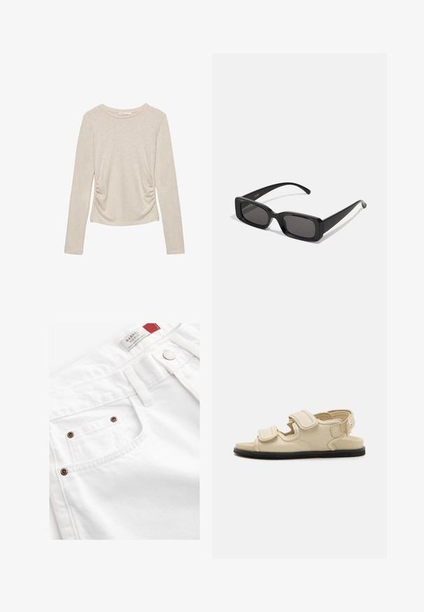 Beżowa bluzka z długim rękawem, okrągłym dekoltem i marszczeniami po bokach, wykonana z miękkiej, teksturowanej tkaniny.; Białe dżinsowe szorty z średnim stanem, pięcioma kieszeniami i akcentami w kolorze miedzi. Teksturowany materiał z haftowanymi detalami.; Beżowe skórzane sandały z dwiema regulowanymi paskami na rzep, zabudowanym czubkiem i czarną gumową podeszwą. Charakteryzują się minimalistycznym designem i otwartym tyłem.; Czarne prostokątne okulary przeciwsłoneczne z ciemnymi szkłami, błyszczącym wykończeniem, szerokimi zausznikami i masywną konstrukcją. Wygrawerowana nazwa marki na jednym z zauszników.