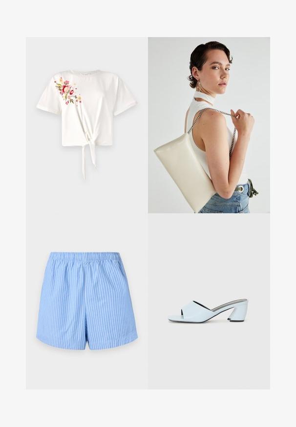 T-shirt blanc à manches courtes avec un devant noué. Présente une broderie florale en rose et jaune sur le côté gauche. Matière en coton doux.; Shorts bleu ciel avec des rayures verticales blanches, taille élastique, longueur mi-cuisse et texture en coton lisse.; Mules à talons ouverts bleu clair avec un design géométrique, dotés d'une large bride sur le pied et d'un talon épais et angulaire.; Pochette rectangulaire blanche en matériau brillant, avec une bandoulière en chaîne argentée. Le modèle pose en mettant en valeur le sac contre un fond uni.