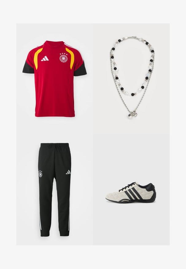 Rdeča nemška reprezentančna nogometna majica z črnimi rokavi, rumenimi ramenimi poudarki, logotipom Adidas in grbom ekipe s štirimi zvezdami na prsih.; Črne trenirke z vrvico v pasu, ki imajo bele stranske črte, emblem s petimi zvezdami in logotip Adidas na stegnu.; Adidas športna obutev s teksturiranim svetlo sivim zgornjim delom in črnimi usnjenimi detajli. Ima črn logo s tremi črtami in oblazinjeno podplatom.; Dvoplastna ogrlica, ki vključuje srebrno verigo, mešane perle v črni, beli in kremni barvi ter dekorativne charms, ki posnemajo kocke in kroglico.