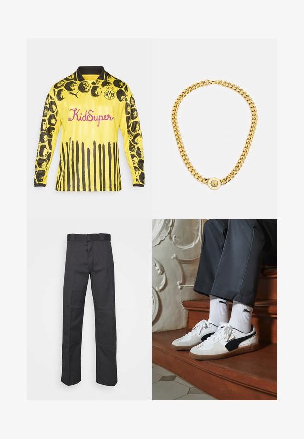 Geel voetbalshirt met lange mouwen, voorzien van zwarte cirkel- en streepjespatronen, een zwarte kraag en "KidSuper" in roze letters.; Zwarte broek van duurzaam materiaal, met een rechte pijpdesign, een tailleband met riemlussen en naden voor extra textuur.; Puma sneakers in wit en zwart suède, met een bruine rubberen zool. Gecombineerd met witte sokken met een zwart logo, gedragen met donkere broek.; Gouden ketting met grote onderling verbonden schakels, met een ronde hanger in het midden met een verhoogd embleem.