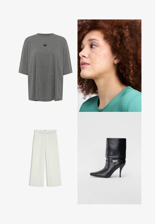 Grijze oversized t-shirt van zachte stof. Heeft een ronde halslijn, korte mouwen en een subtiel logo in het midden.; Wijde broek in licht crèmekleurige stof, met zijzakken, een platte voorkant en een enkele knoopsluiting bij de taille. Glad van textuur.; Zwarte leren enkelboot met een spitse neus, hoge stilettohak, opgevouwen manchet en een gouden decoratieve gespdetails op de enkel.; Zilveren studoorbel met een circulair ontwerp en een gestructureerde rand, gedragen door een persoon met krullend kastanjebruin haar, gekleed in een groene top.