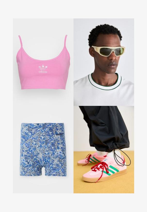 adidas Originals BRA - Top - purple; Plave bokserice s cvjetnim uzorkom u kombinaciji nijansi, s ugodnim dizajnom i crnim Adidas logotipom na pojasu.; Roze suede tenisice s zelenim prugama, crvenim vezicama i gumenom petom. Uparene s crnim hlačama skupljenim oko gležnjeva.; Naočale sa prozirnim žutim okvirom i zelenim staklima. Angulirani dizajn s širokim ručkama, nosi se s bijelom košuljom koja ima zelene akcentne detalje.