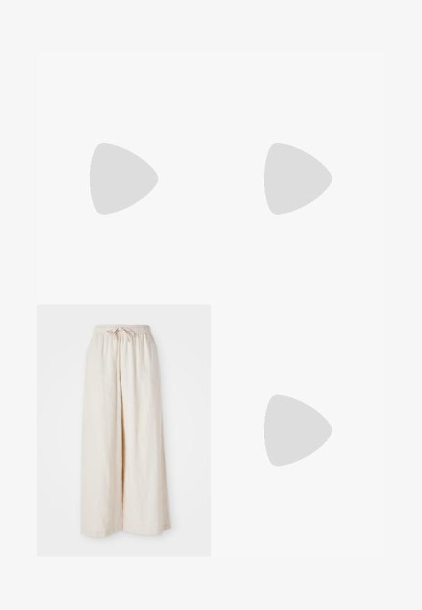 Brown ribbed crop top with a halter neck design, contrasting light pink trim, and "ruby" logo embroidered in white on the front.; Wide-leg, cream-colored trousers with an elastic waistband and drawstring. Smooth, lightweight linen fabric, no visible patterns or hardware.; Black leather and synthetic sneakers with white Nike swoosh, rubber gum sole, round toe, and black laces. Ribbed white socks visible.; Silver hoop earrings with a smooth, polished finish. Circular shape, consistent width, designed for easy fastening. Simple and elegant.