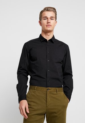 Svarte Skjorter til dame, herre og barn Esprit på nett hos Svarte Skjorter til dame, herre og barn Esprit på nett hos